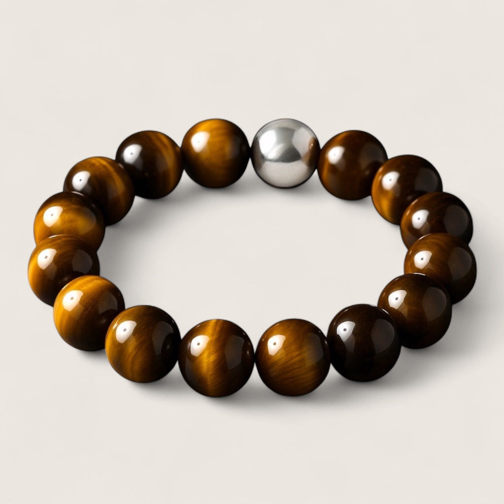 The Sentinel – Tiger Eye Stretch Bracelet-Channel strength, focus, and protection with the Sentinel Bracelet. Natural Tiger Eye beads and steel accent offer bold style and resilience. Shop now.