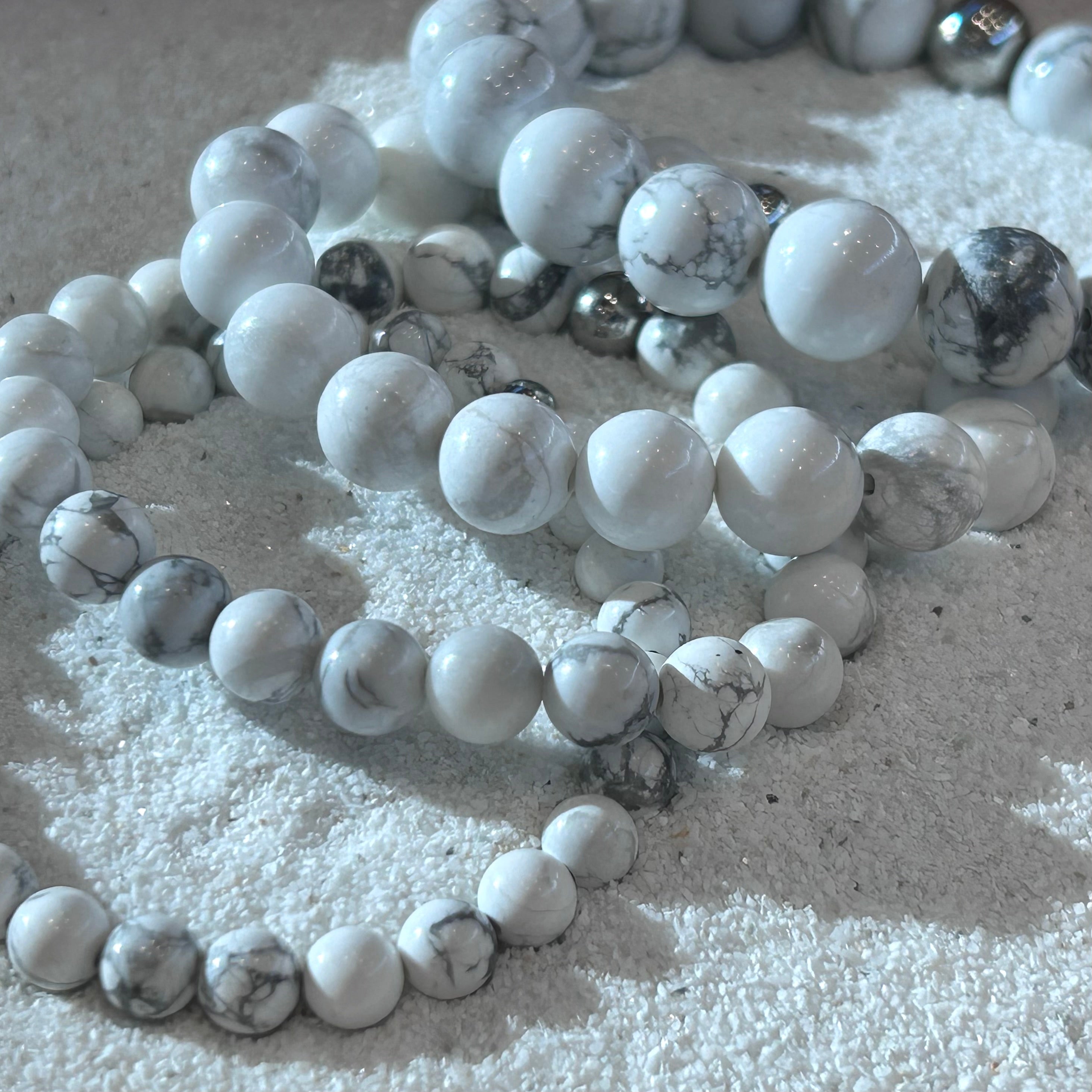 Frostveil – Howlite Stretch Bracelet-Calm your mind and strengthen your spirit with the Frostveil Bracelet. Natural Howlite beads and steel accent offer soothing style and clarity. Shop now.