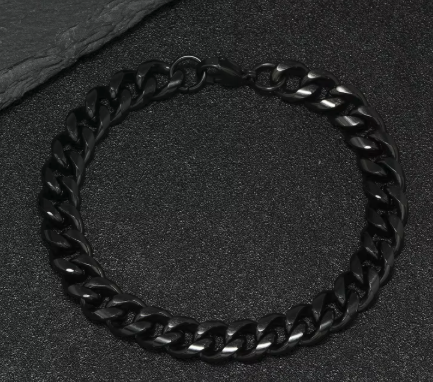 The Nightfall – 9 mm Cuban Link Chain Bracelet-Make a powerful statement with the 9mm Black Cuban Link. Solid polished links plated in jet black—bold, scratch-resistant, and built to last. Shop now.