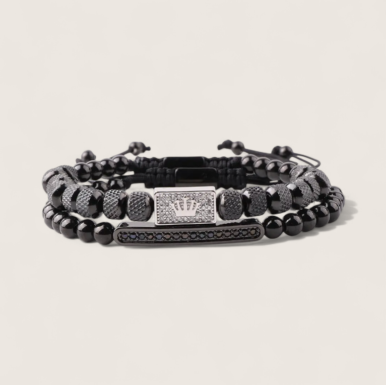 The Crowned Pair- Steel Double Bracelet-Forge your style with the Crowned Pair Bracelet. Dual-strand design with pavé CZ bar and crowned enamel bead. Adjustable black pull-cords. Shop now.