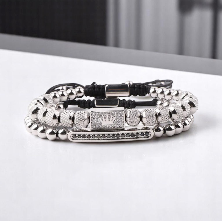 The Crowned Pair- Steel Double Bracelet-Forge your style with the Crowned Pair Bracelet. Dual-strand design with pavé CZ bar and crowned enamel bead. Adjustable black pull-cords. Shop now.