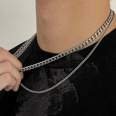 Cascade Duo – Polished Steel Layered Necklace-Make a statement with the Cascade Curb Duo. Three polished steel curb chains layer bold shine and depth for dynamic, dimensional style. Shop now.