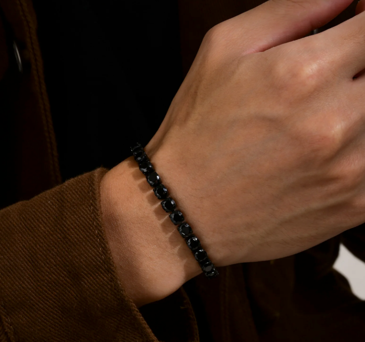 Night Surge Tennis Bracelet-Strike a bold chord with the Blackout Tennis Bracelet. Black-plated steel and deep black CZ stones radiate dark, electrifying intensity. Shop now.