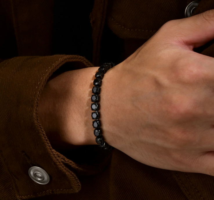 Night Surge Tennis Bracelet-Strike a bold chord with the Blackout Tennis Bracelet. Black-plated steel and deep black CZ stones radiate dark, electrifying intensity. Shop now.