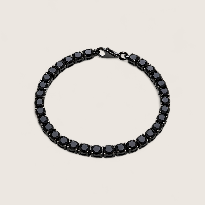 Night Surge Tennis Bracelet-Strike a bold chord with the Blackout Tennis Bracelet. Black-plated steel and deep black CZ stones radiate dark, electrifying intensity. Shop now.