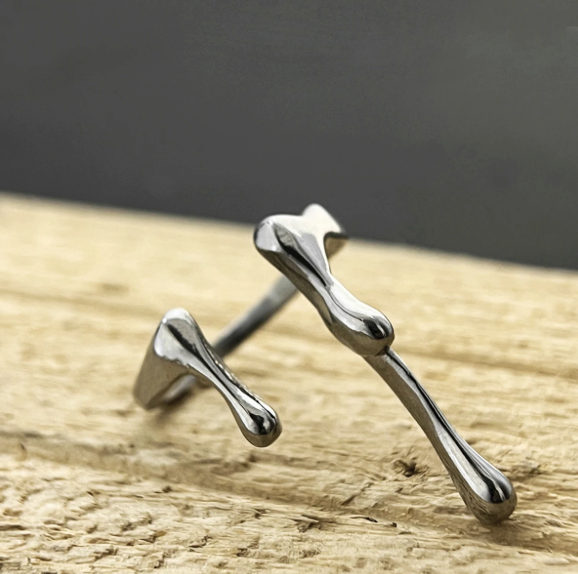 Reactor Drip – Statement Ring-Channel raw energy with the Reactor Drip Ring. Polished steel, sculptural open-band design with opposing arcs. Adjustable fit. Shop now.
