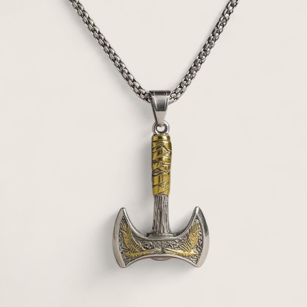 Pendant shaped like a Viking axe on a chain against a light gray background