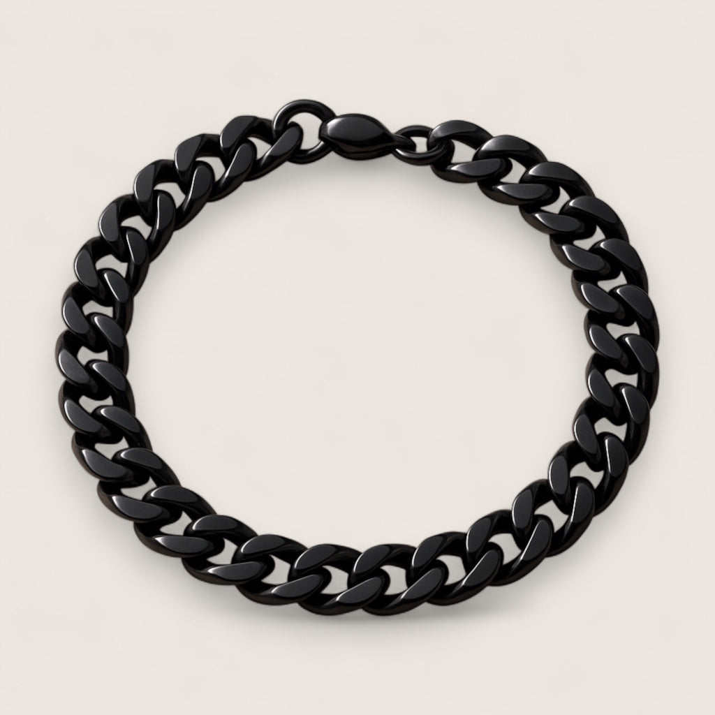 The Nightfall – 9 mm Cuban Link Chain Bracelet-Make a powerful statement with the 9mm Black Cuban Link. Solid polished links plated in jet black—bold, scratch-resistant, and built to last. Shop now.