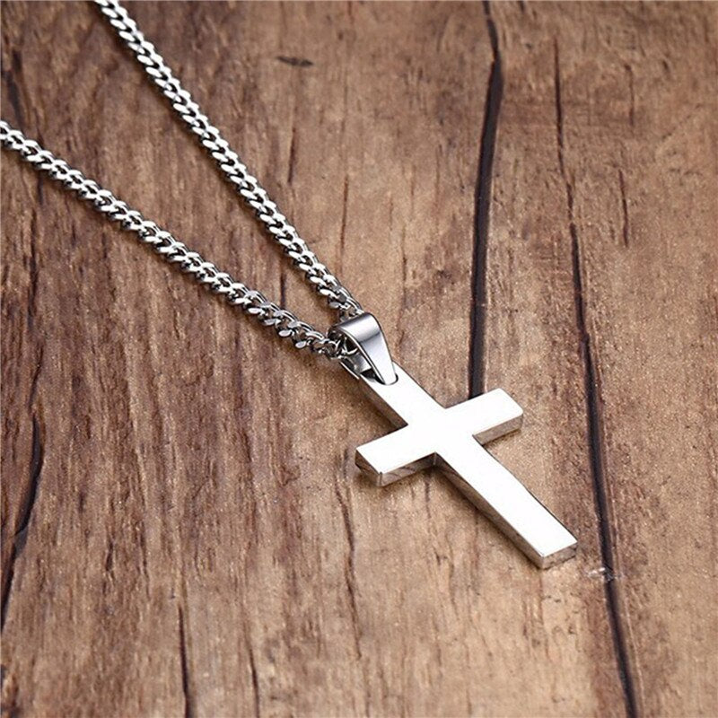 The Guardian – Cross Necklace-Discover the Men’s Smooth Cross Necklace: mirror-polished stainless steel (20 × 35 mm) on a 24″ chain. Tarnish-resistant shine—shop at Anvil&Ore.