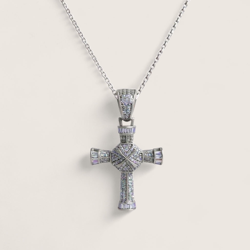 Silver cross pendant necklace on a light gray background