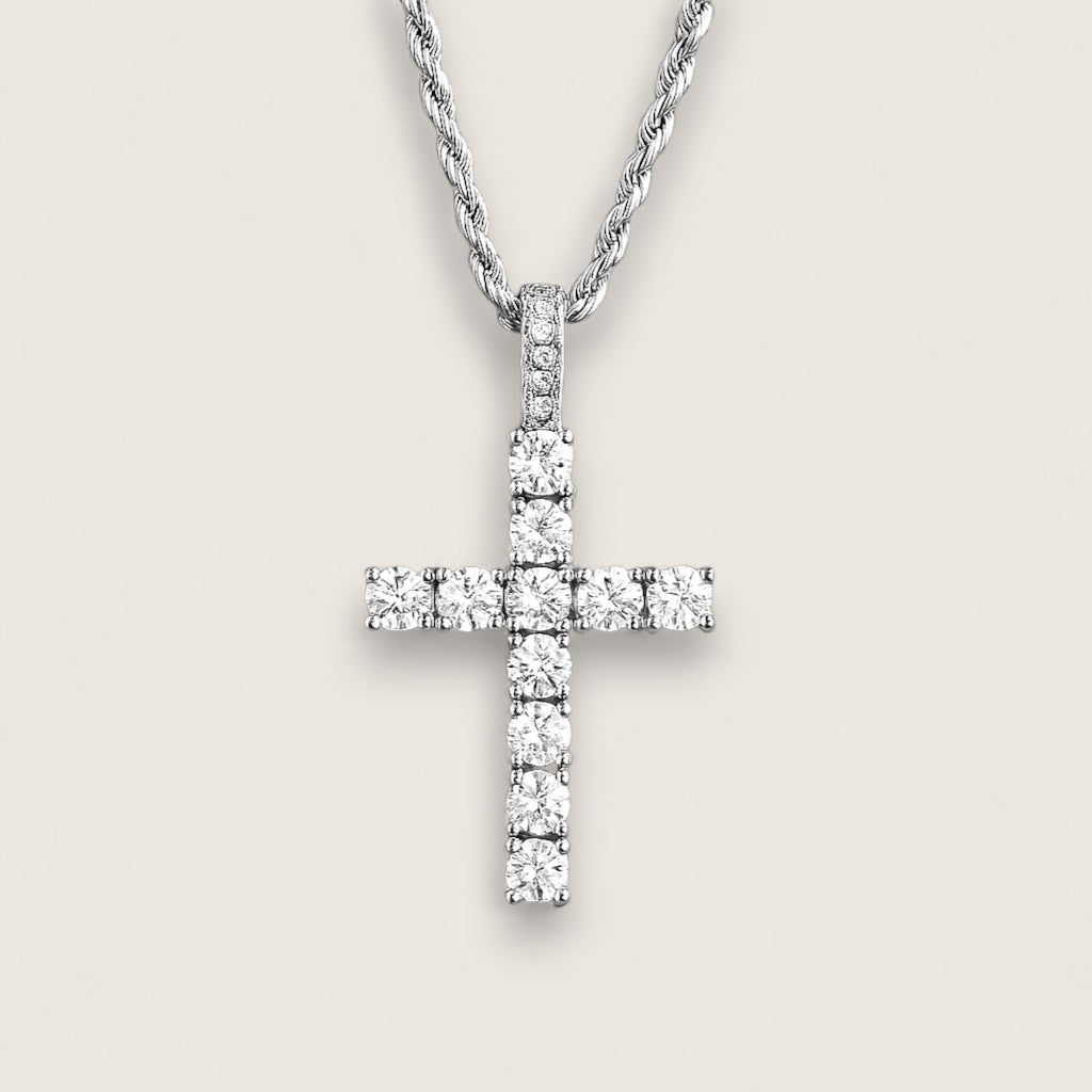 Diamond cross pendant on a light gray background