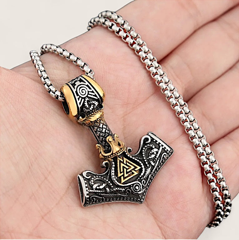 Viking hammer pendant necklace on a hand