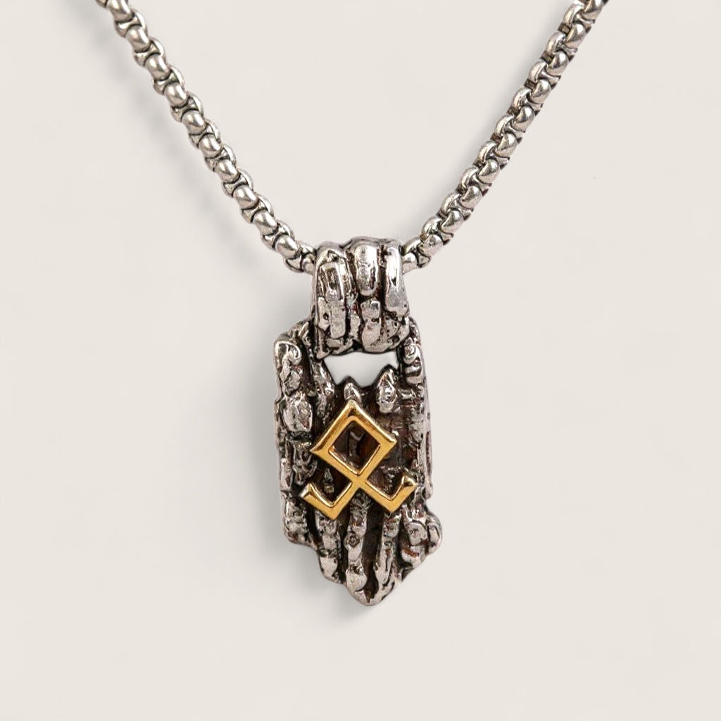 Necklace with a hand-shaped pendant featuring a gold square design on a light gray background