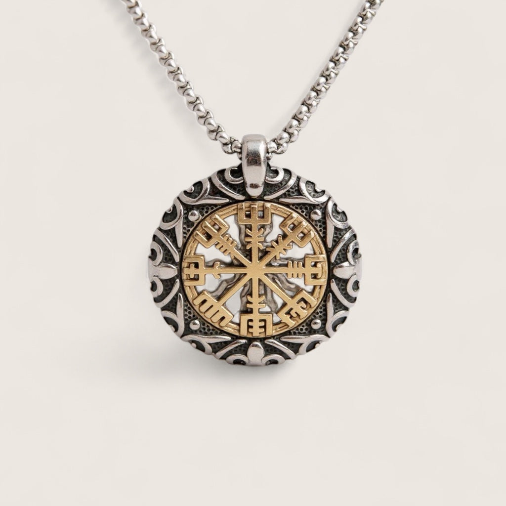 Necklace with a round pendant featuring a gold and silver design on a light gray background