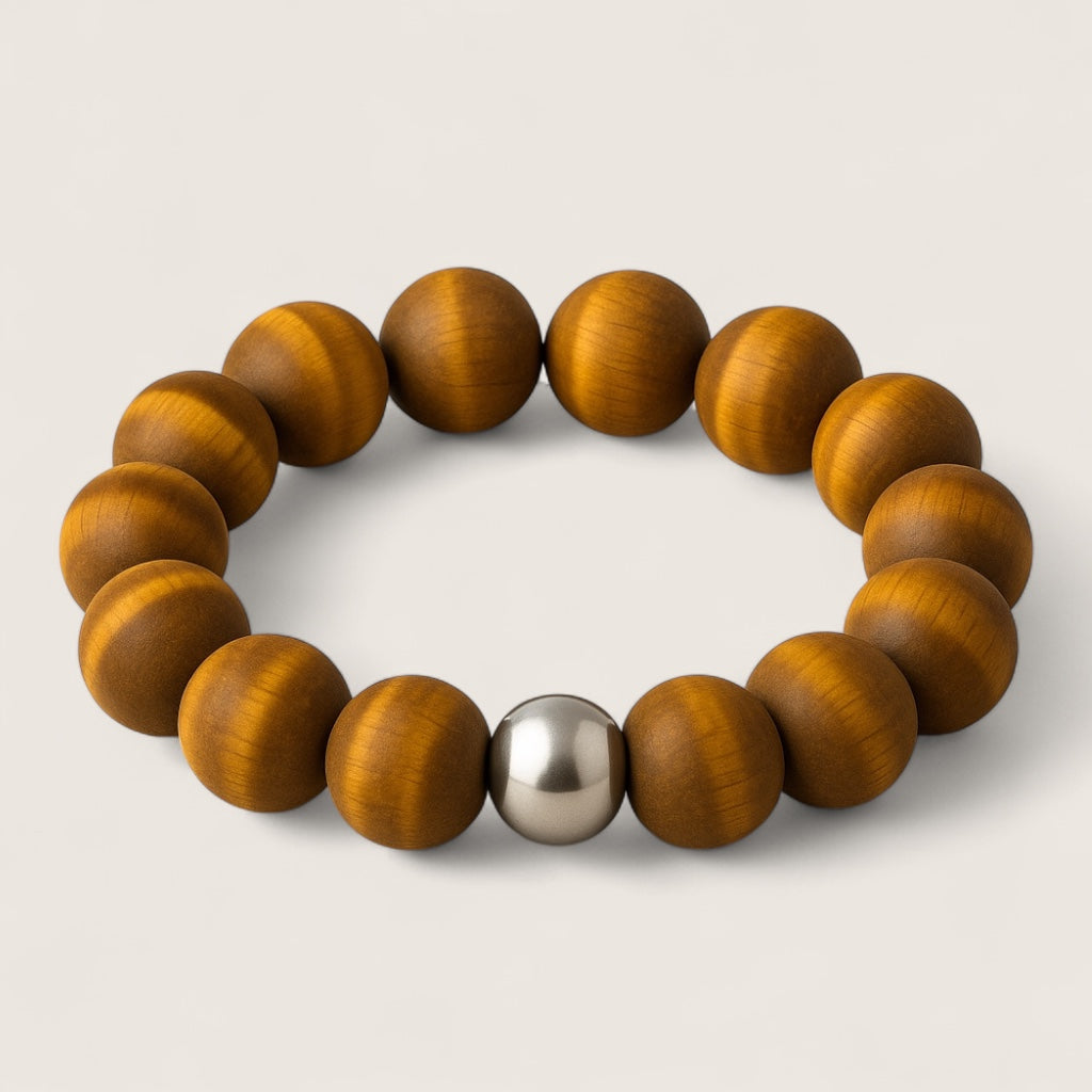 The Sentinel – Tiger Eye Stretch Bracelet-Channel strength, focus, and protection with the Sentinel Bracelet. Natural Tiger Eye beads and steel accent offer bold style and resilience. Shop now.