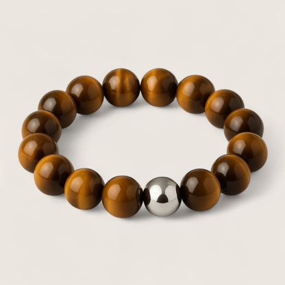 The Sentinel – Tiger Eye Stretch Bracelet-Channel strength, focus, and protection with the Sentinel Bracelet. Natural Tiger Eye beads and steel accent offer bold style and resilience. Shop now.