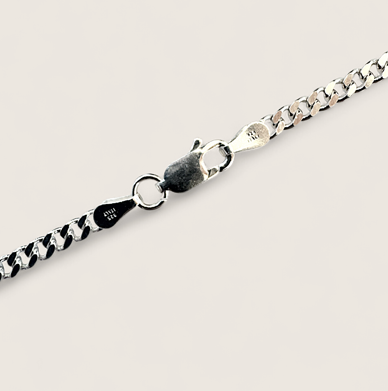 The Argent Curb – 4.5mm Sterling Silver Chain-4.5mm solid sterling silver curb chain. Polished flat links, crafted in Italy. Clean, bold silhouette—wear solo or layered. Shop now.