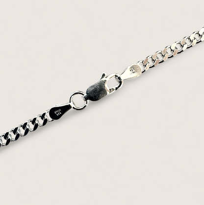 The Argent Curb – 4.5mm Sterling Silver Chain-4.5mm solid sterling silver curb chain. Polished flat links, crafted in Italy. Clean, bold silhouette—wear solo or layered. Shop now.
