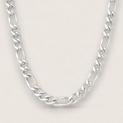 The Argent Figaro – 5.7mm Sterling Silver Chain-Bold 5.7mm sterling silver Figaro chain, diamond-cut for texture and shine. Crafted in Italy. A timeless statement piece. Shop now.