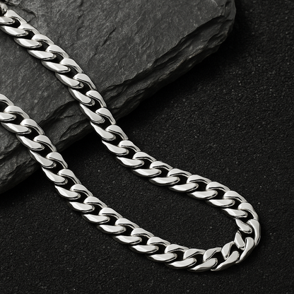 The Argent Curb – 6.7mm Sterling Silver Chain-6.7mm solid sterling silver curb chain. Polished flat links crafted in Italy for bold, versatile style. Wear solo or layered. Shop now.