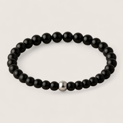 Shadowblade – Black Agate Stretch Bracelet-Forge your style with the Shadowblade Bracelet — polished black agate for strength and grounding. Finished with a steel accent. Available in multiple sizes.