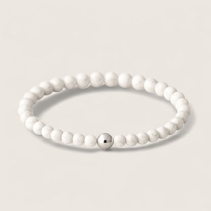 Frostveil – Howlite Stretch Bracelet-Calm your mind and strengthen your spirit with the Frostveil Bracelet. Natural Howlite beads and steel accent offer soothing style and clarity. Shop now.