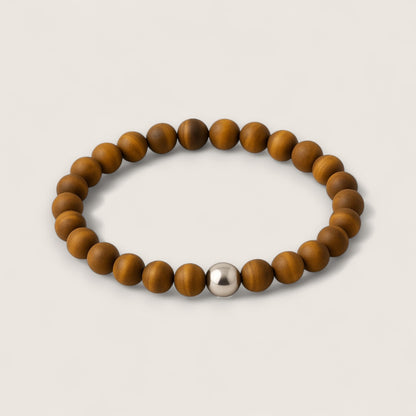 The Sentinel – Tiger Eye Stretch Bracelet-Channel strength, focus, and protection with the Sentinel Bracelet. Natural Tiger Eye beads and steel accent offer bold style and resilience. Shop now.