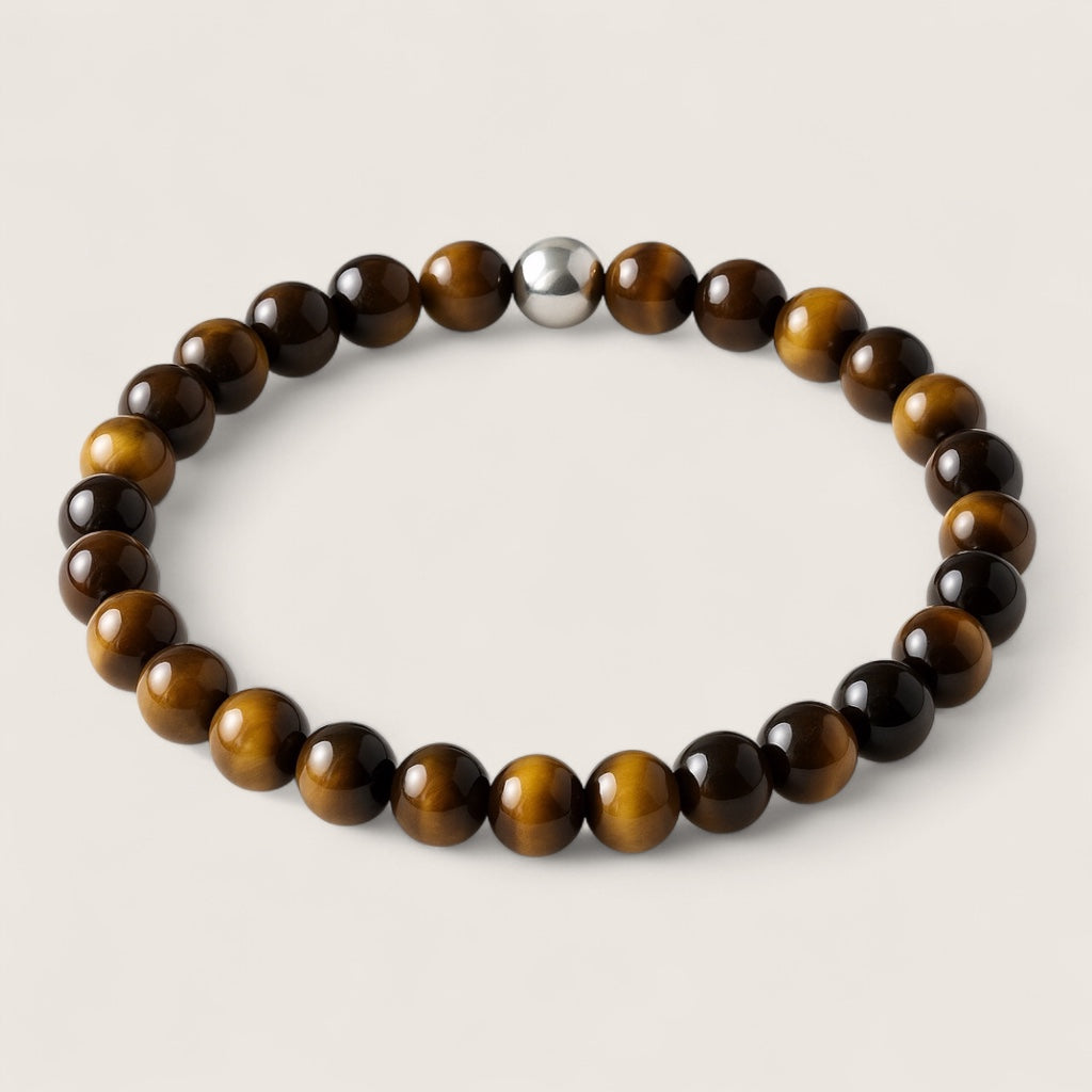The Sentinel – Tiger Eye Stretch Bracelet-Channel strength, focus, and protection with the Sentinel Bracelet. Natural Tiger Eye beads and steel accent offer bold style and resilience. Shop now.