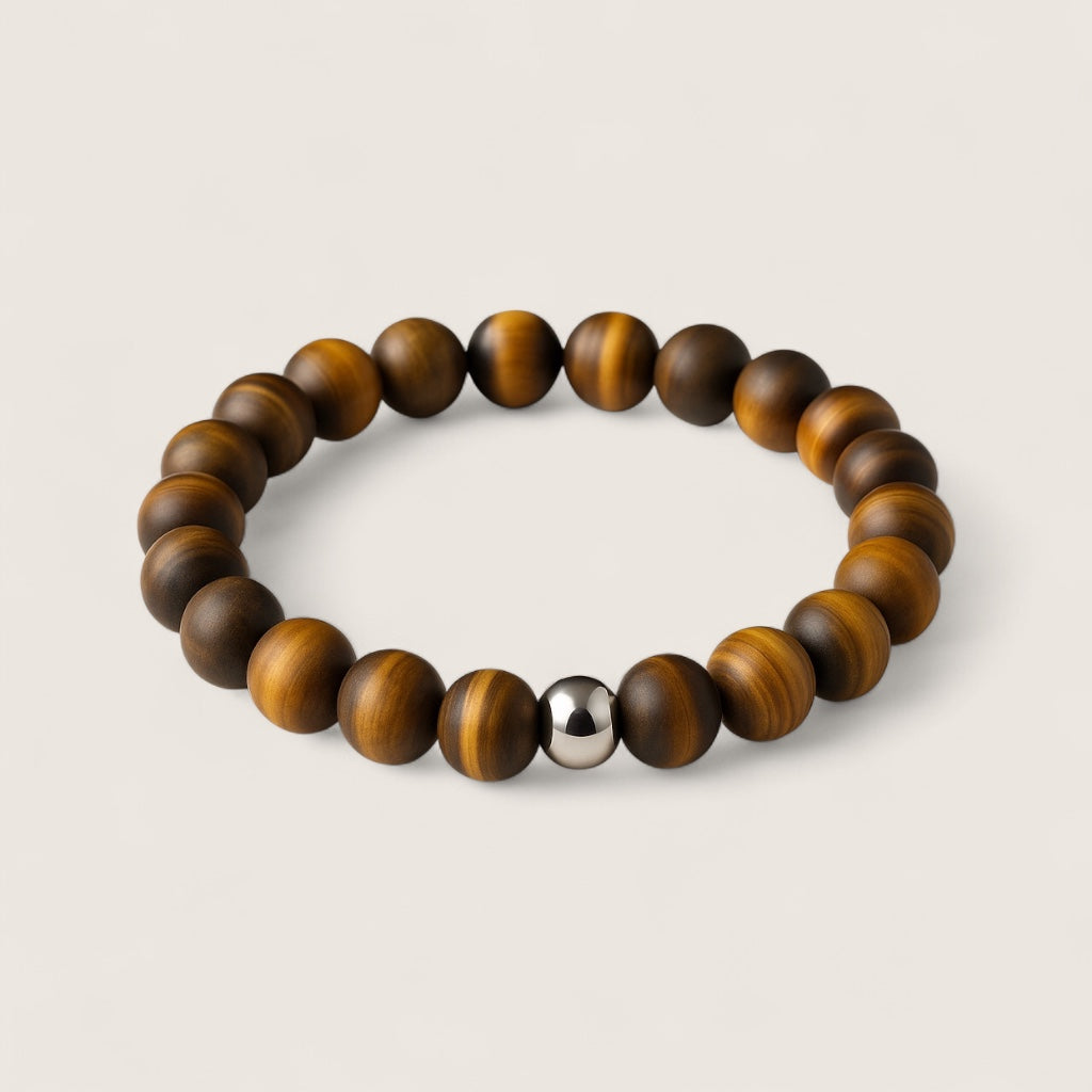 The Sentinel – Tiger Eye Stretch Bracelet-Channel strength, focus, and protection with the Sentinel Bracelet. Natural Tiger Eye beads and steel accent offer bold style and resilience. Shop now.