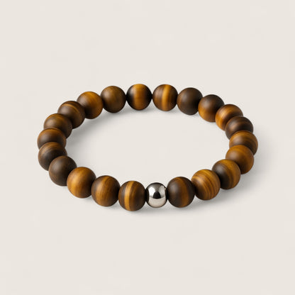 The Sentinel – Tiger Eye Stretch Bracelet-Channel strength, focus, and protection with the Sentinel Bracelet. Natural Tiger Eye beads and steel accent offer bold style and resilience. Shop now.