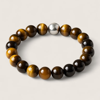 The Sentinel – Tiger Eye Stretch Bracelet-Channel strength, focus, and protection with the Sentinel Bracelet. Natural Tiger Eye beads and steel accent offer bold style and resilience. Shop now.