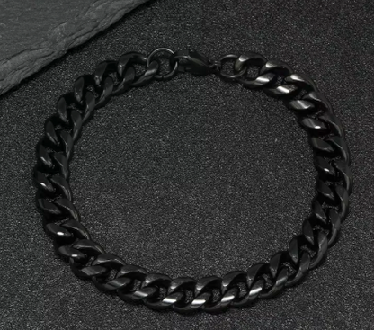 The Nightfall – 9 mm Cuban Link Chain Bracelet-Make a powerful statement with the 9mm Black Cuban Link. Solid polished links plated in jet black—bold, scratch-resistant, and built to last. Shop now.