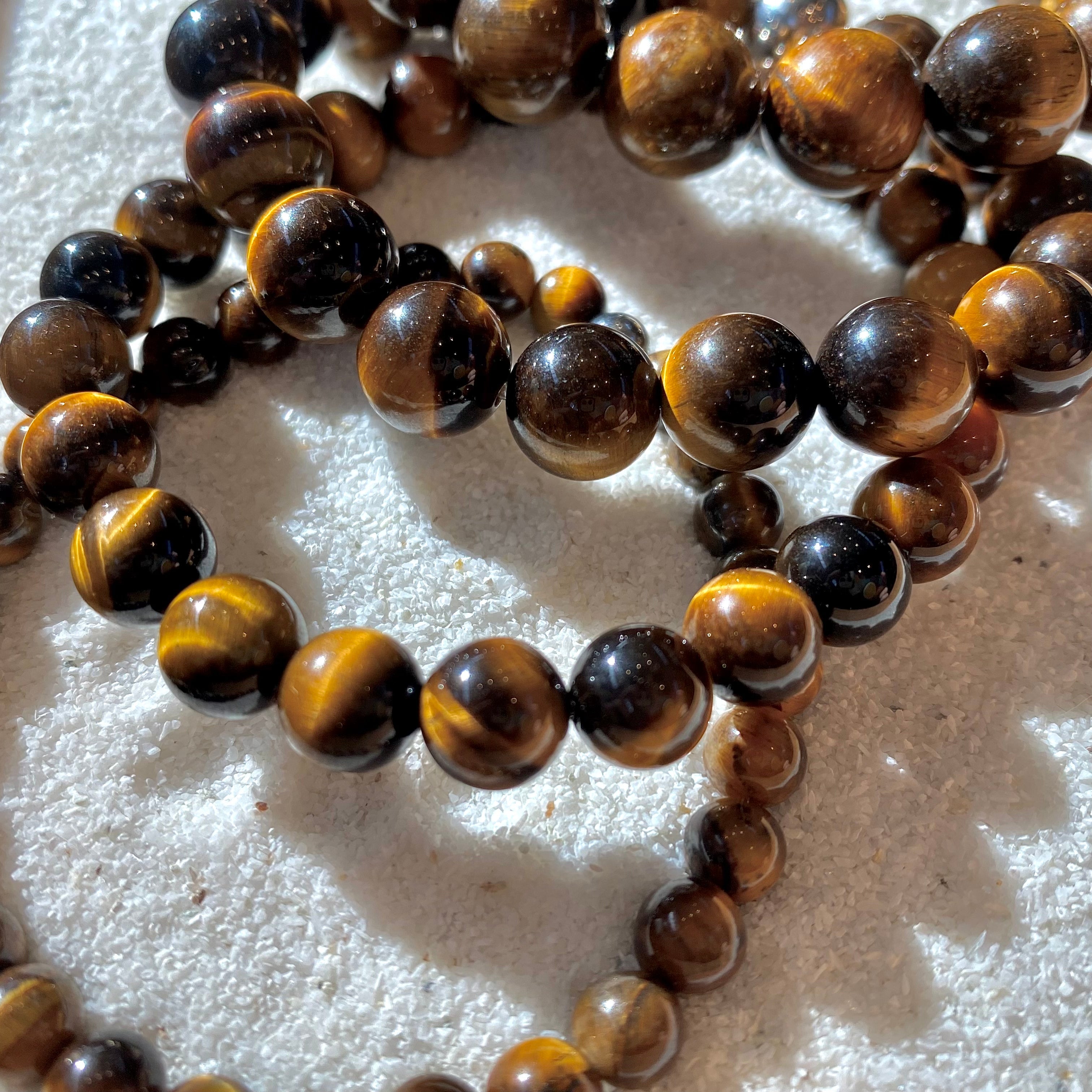 The Sentinel – Tiger Eye Stretch Bracelet-Channel strength, focus, and protection with the Sentinel Bracelet. Natural Tiger Eye beads and steel accent offer bold style and resilience. Shop now.