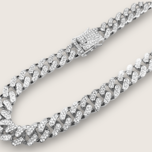The Avalanche – 12.5 mm Iced Curb Chain-Make an impact with the Avalanche Iced Curb Chain. 12.5mm CZ-encrusted gold or silver chain with secure clasp. Available as bracelet or necklace. Shop now.