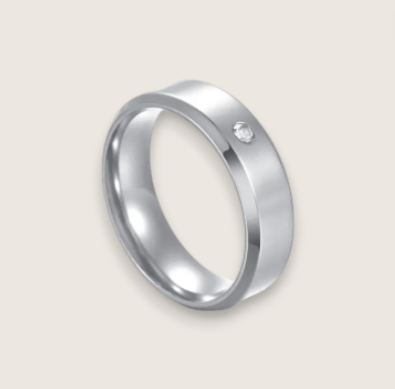 The Solis Solitaire – Flat Stainless Steel Ring-Discover The Solis Solitaire: a sleek 4 mm or 6 mm flat stainless steel ring in silver or gold finish, featuring a bezel-set CZ for refined minimalism. Shop Now