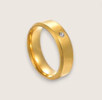 The Solis Solitaire – Flat Stainless Steel Ring-Discover The Solis Solitaire: a sleek 4 mm or 6 mm flat stainless steel ring in silver or gold finish, featuring a bezel-set CZ for refined minimalism. Shop Now