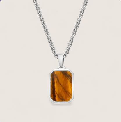 The Aegis - Tiger Eye Dog tag Necklace-Channel nature’s power with the Aegis Pendant. Tiger eye stone set in polished, gold, or matte black steel. Bold geometric style on a 24" chain. Shop now.