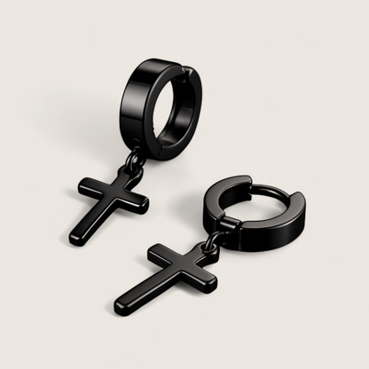The Creed - Cross Dangle Huggies Earrings-Forge bold style with the Creed Cross Huggies. Polished steel small hoops with dangling cross pendants. Available in steel or gold. Shop now.