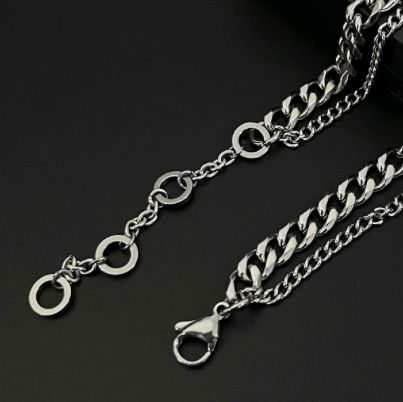Cascade Duo – Polished Steel Layered Necklace-Make a statement with the Cascade Curb Duo. Three polished steel curb chains layer bold shine and depth for dynamic, dimensional style. Shop now.