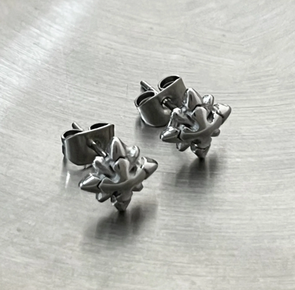 Starbreaker Studs – 8mm Edgy Star Steel Earrings-Channel supernova energy with Micro-Star Studs. CNC-milled steel stars catch light like electric sparks. Bold, scratch-resistant style. Shop now.