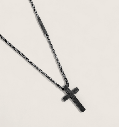 The Crucible Cross Necklace-Temper your look with the Crucible Cross Necklace. Black titanium-plated steel cross on bold 28" box chain. Industrial elegance with Voltage edge. Shop now.