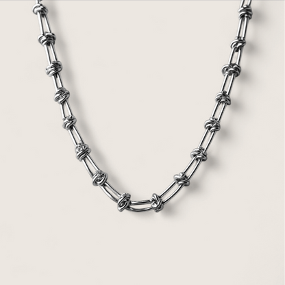 Fluxwire Chain-Electric tension forged in steel—Fluxwire Necklace. Intricate, fractured links pulse with chaotic energy. Layer it or wear solo. Shop now.
