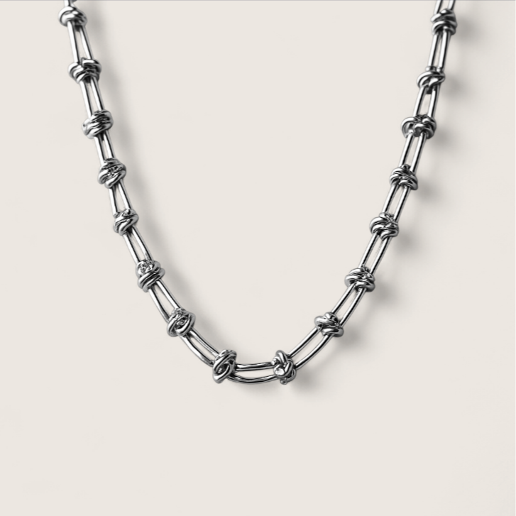 Fluxwire Chain-Electric tension forged in steel—Fluxwire Necklace. Intricate, fractured links pulse with chaotic energy. Layer it or wear solo. Shop now.