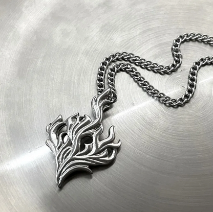 The Hearthfire Pendant – Steel Flame Necklace-Channel forge energy with the Hearthfire Pendant. Sculpted flame in polished steel on an adjustable 24" curb chain. Bold and transformative. Shop now.