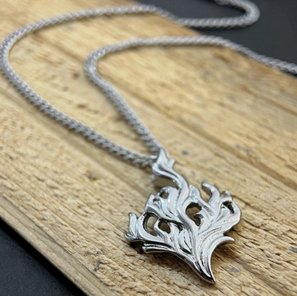 The Hearthfire Pendant – Steel Flame Necklace-Channel forge energy with the Hearthfire Pendant. Sculpted flame in polished steel on an adjustable 24" curb chain. Bold and transformative. Shop now.