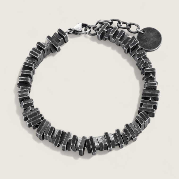 The Relic – Antique-Geometric Steel Bracelet-Channel industrial heritage with the Relic Bracelet. Aged steel segments with antique patina evoke rugged refinement and bygone craftsmanship. Shop now.