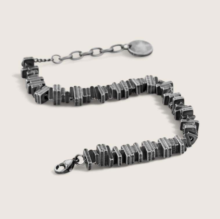 The Relic – Antique-Geometric Steel Bracelet-Channel industrial heritage with the Relic Bracelet. Aged steel segments with antique patina evoke rugged refinement and bygone craftsmanship. Shop now.