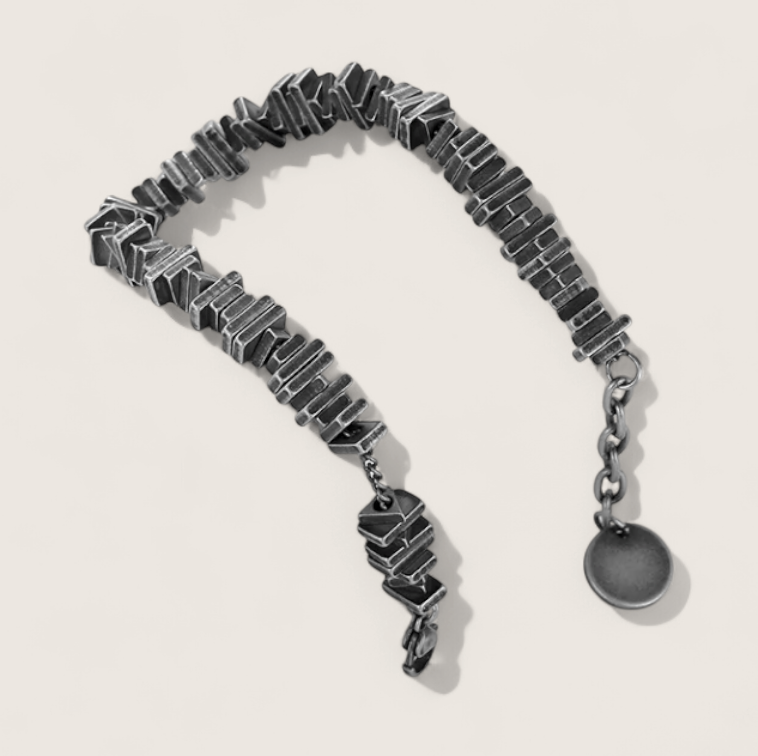 The Relic – Antique-Geometric Steel Bracelet-Channel industrial heritage with the Relic Bracelet. Aged steel segments with antique patina evoke rugged refinement and bygone craftsmanship. Shop now.