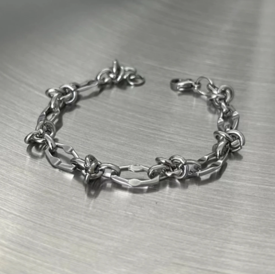 Flux Knot Bracelet-Chaos with control—Flux Knot Bracelet. Polished steel links and knotted elements flow with bold, kinetic style. Lightweight Voltage energy. Shop now.