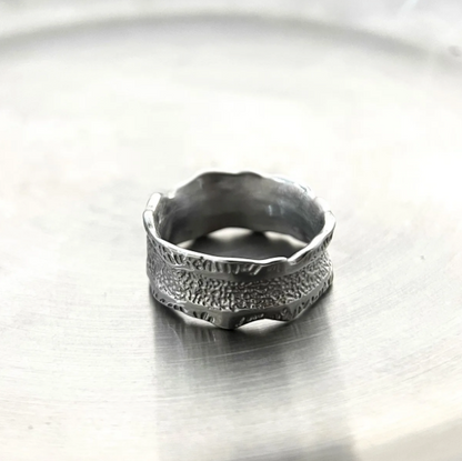 Bolt Rift - Textured Concaved Ring-Channel storm energy with the Bolt Rift Ring. 8mm steel band with oxidized lightning-texture and polished edges. Bold Voltage style. Shop now.